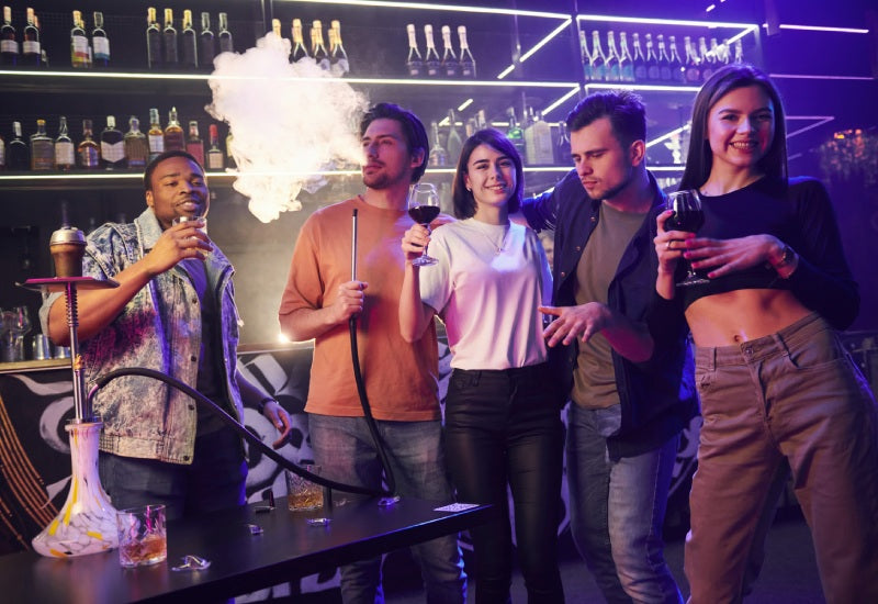 girls and boys smoking hookah